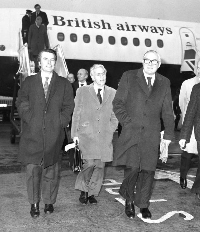 David Owen and Jim Callaghan leave a BA plane at Heathrow Airport