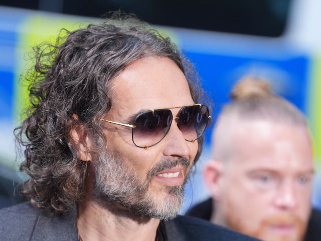 Russell Brand wearing sunglasses