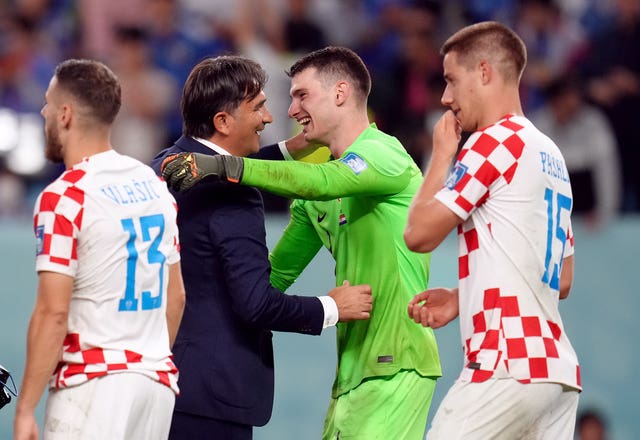 Croatia boss Zlatko Dalic congratulates goalkeeper Dominik Livakovic