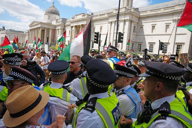 People taking part in a demonstration at Trafalgar Square in support of Palestine Action