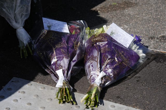 Floral tributes on Overbury Street, near the scene in Rushmore Road, Clapton, east London, after a man was stabbed to death. 