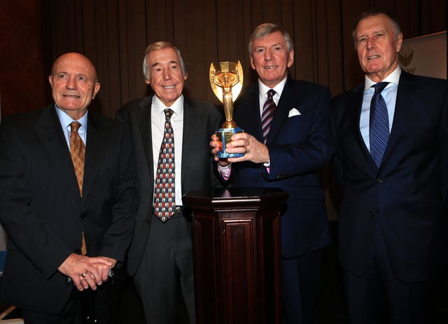 Former England and World Cup winning players (left to right) George Cohen, Gordon Banks, Martin Peters and Sir Geoff Hurst with the Jules Rimet trophy