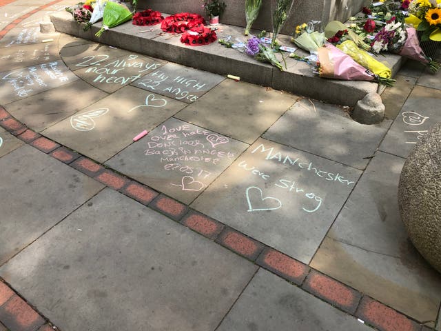 Floral tributes and messages in St Ann’s Square in Manchester city centre to mark the second anniversary of the Manchester Arena terror attack 