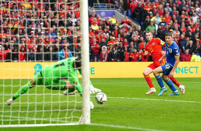 Georgiy Bushchan, left, saves from Gareth Bale, centre, in the closing stages