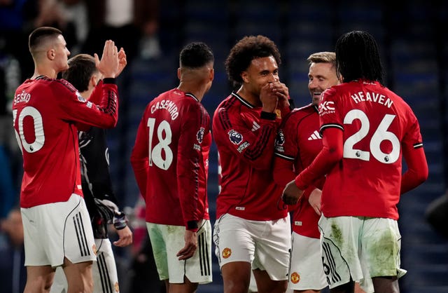 Joshua Zirkzee, centre, leads the Manchester United celebrations after victory over Chelsea