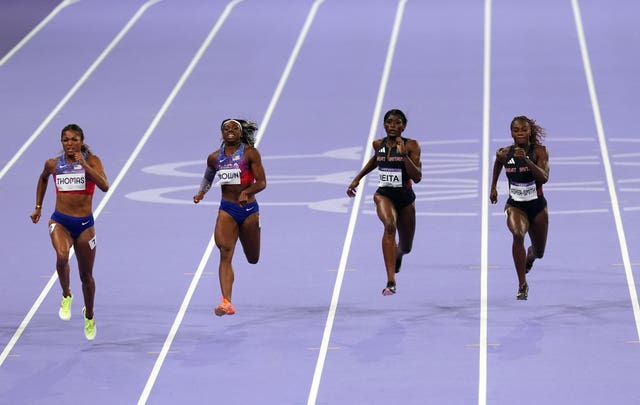 Gabby Thomas, Brittany Brown, Daryll Neita and Dina Asher-Smith , left to right, finish the Olympic women's 200m final