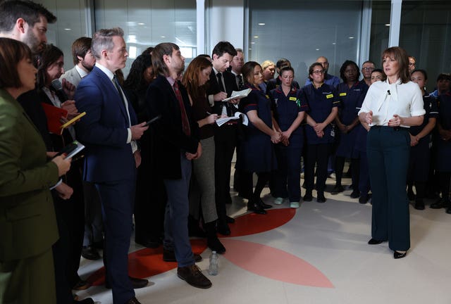 Rachel Reeves, standing in front of NHS nurses, addresses political journalists after the Budget