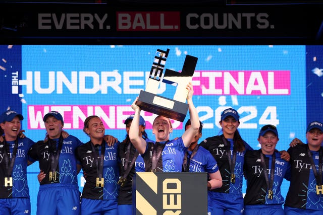 London Spirit captain Heather Knight lifts the 2024 Hundred trophy at Lord's.