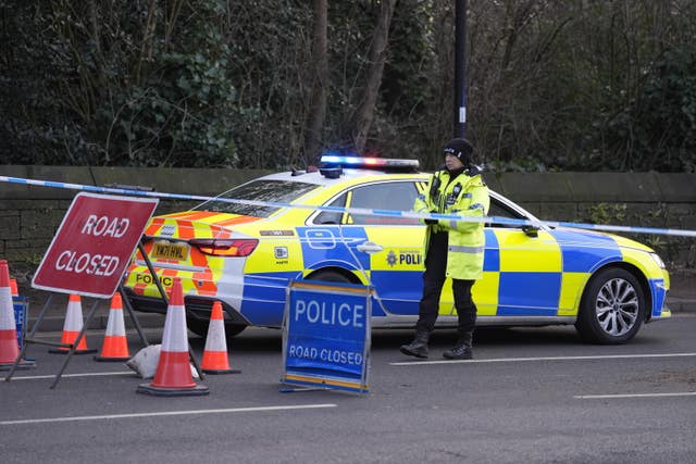 Police block the road near the scene of the incident