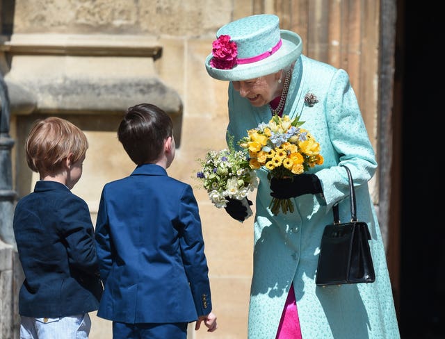 The Queen is presented with flowers