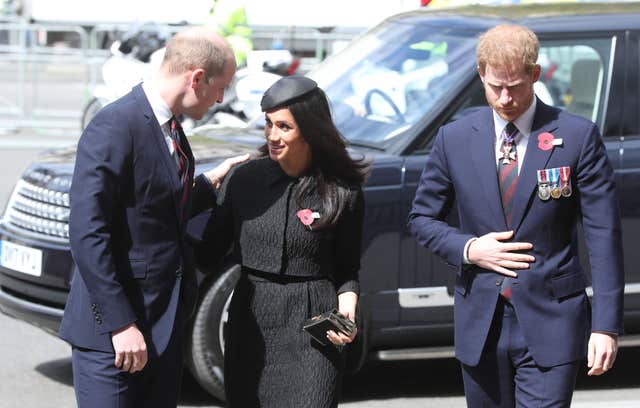 The Duke of Cambridge speaks with Ms Markle and Harry (Jonathan Brady/PA)