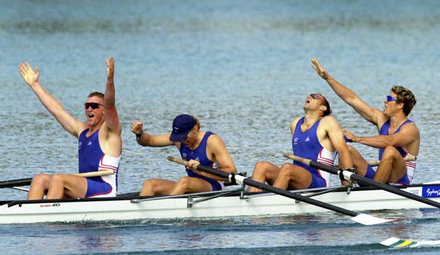 Great Britain rowers (left to right) Matthew Pinsent, Tim Foster, Steve Redgrave and James Cracknell celebrate after winning the Gold Medal in the Men’s Coxless Four Final at the Olympic Games in Sydney