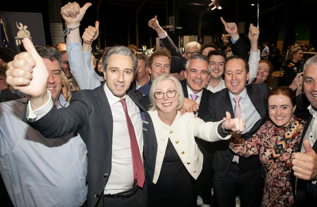 Fine Gael leader and Taoiseach Simon Harris with Regina Doherty and a crowd of people