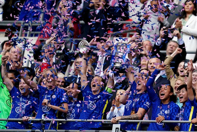 Chelsea’s Magdalena Eriksson and Millie Bright lift the 2022 Women’s FA Cup after victory over Manchester City