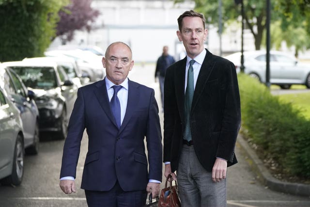 Talent agent Noel Kelly  with his client Ryan Tubridy leaving Leinster House after a parliamentary committee hearing into the controversy 