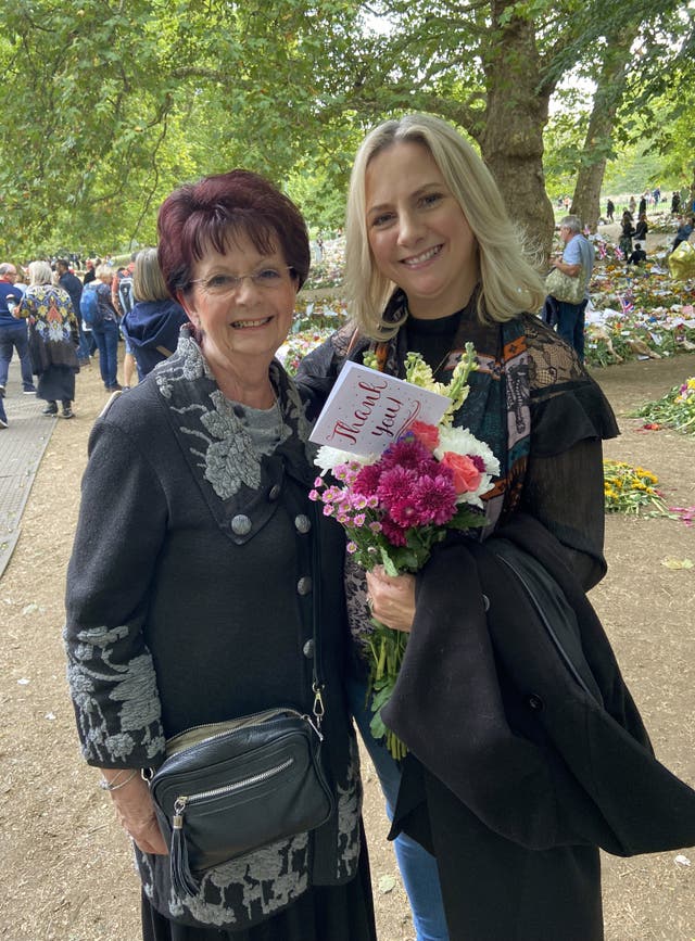 Sue Robinson, left, and daughter Sharon Warner at the floral tribute area in Green Park, London