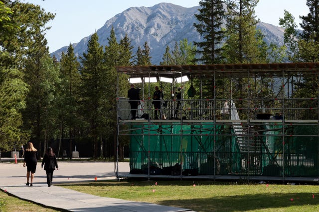 Broadcast television reporters work at the media centre on the grounds of the Pomeroy Kananaskis Mountain Lodge where the G7 summit is taking place in Alberta, Canada