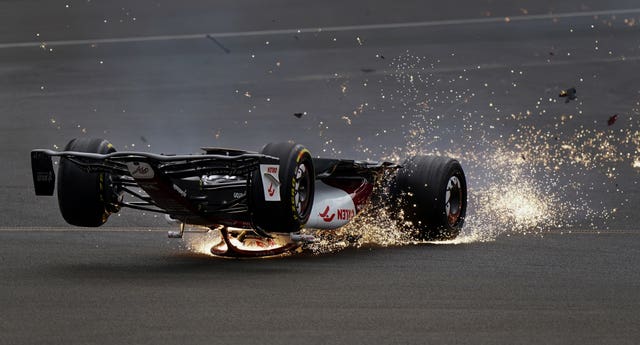 Alfa Romeo’s Zhou Guanyu slides towards the barrier after a dramatic collision at the start of the 2022 British Grand Prix. The Chinese rookie said he did not know how he survived the horrendous opening-corner accident at Silverstone. He ended up wedged between a steel barrier and metal catch fencing after he was flipped upside down and out of control at 160mph but emerged unscathed from one of the biggest crashes in recent Formula One memory