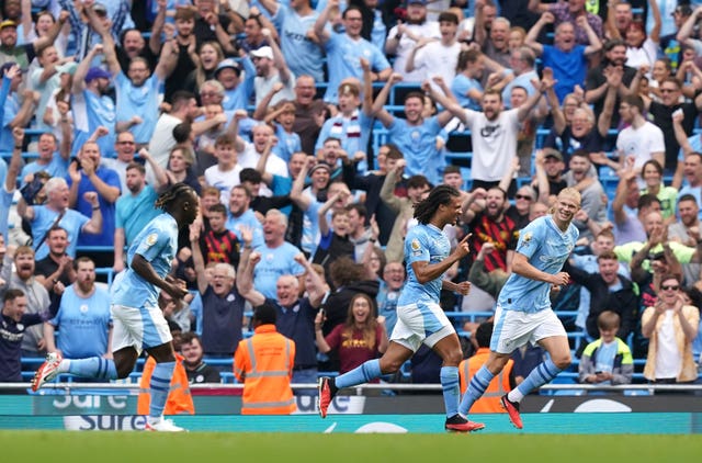 Manchester City celebrate a goal in front of fans