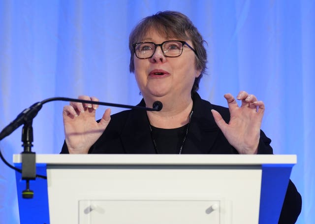 Maria Eagle speaking from a lectern