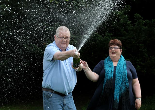 Colin and Chris Weir, from Largs in Ayrshire, celebrate during a photo call at the Macdonald Inchyra Hotel & Spa in Falkirk