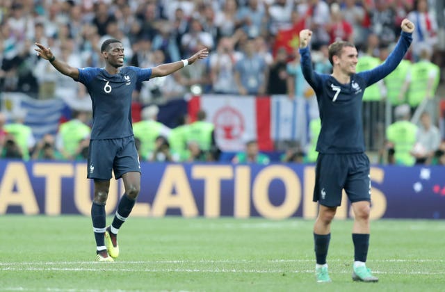 Pogba, left, and team-mate Antoine Griezmann celebrate France's World Cup win