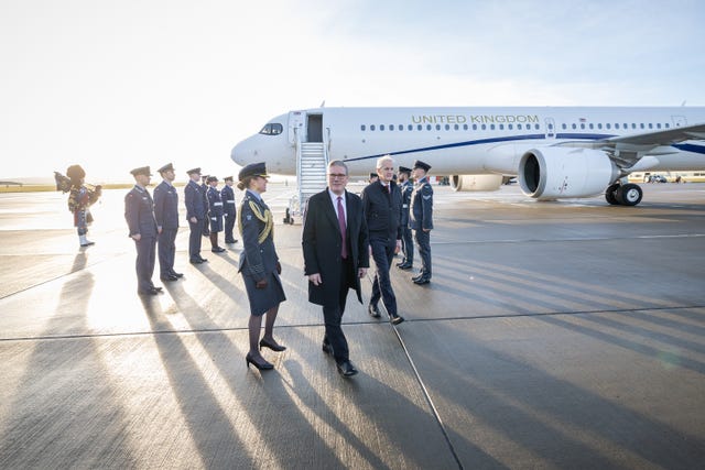 Sir Keir Starmer and Jonas Store being welcomed on the tarmac at RAF Lossiemouth