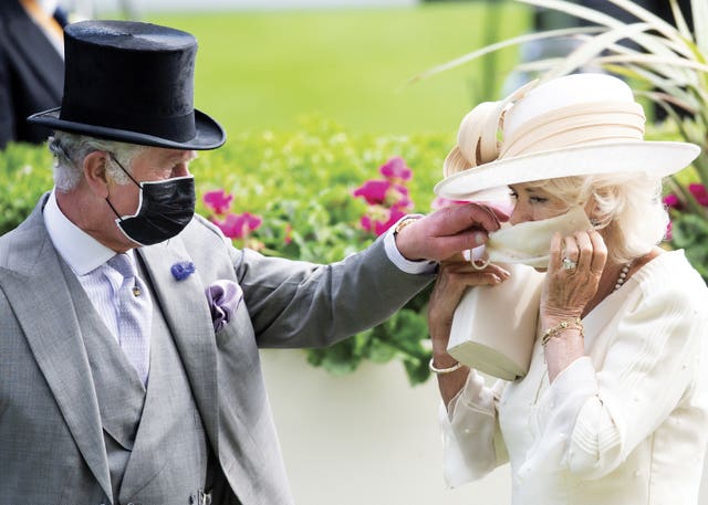 The photograph chosen by the Prince of Wales and Duchess of Cornwall for their Christmas card, which was taken at Royal Ascot by Sam Hussein this year 