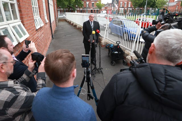 DUP interim leader Gavin Robinson speaks to the media