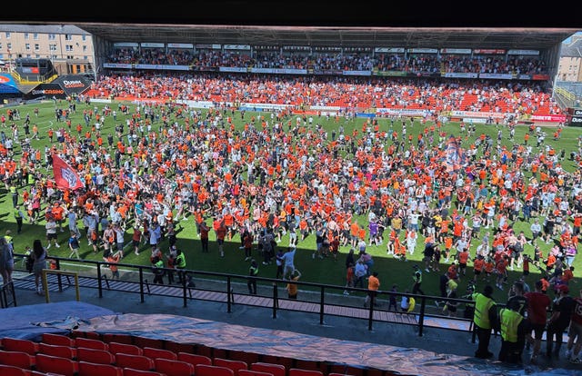 Dundee United fans during a pitch invasion at Tanndice