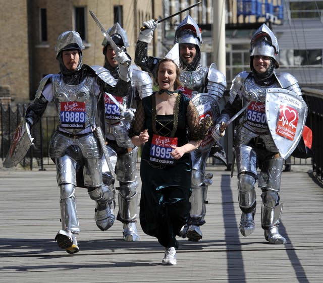 In 2010, Angus Cameron ran the London Marathon with his brothers Hamish, Duncan, and Dougal and his future wife Amy Jevons dressed as Lady Guinevere (Rebecca Naden/PA)