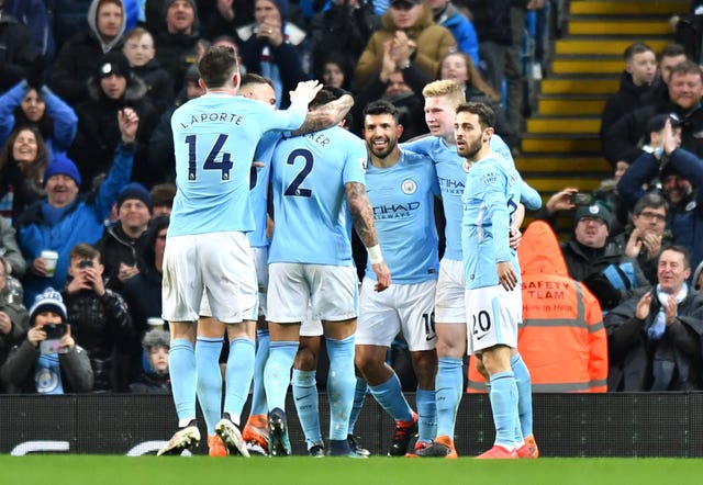 Sergio Aguero (third right) celebrates with his team-mates