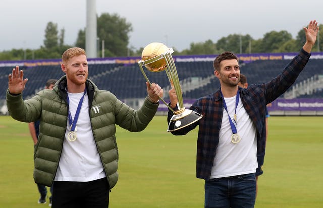 Ben Stokes (left) and Mark Wood celebrate with Cricket World Cup in Durham