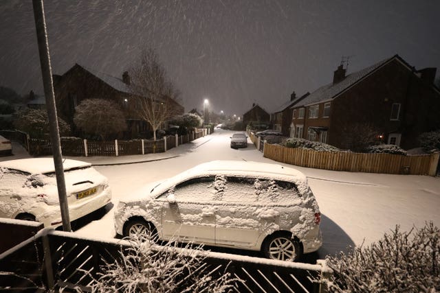 Overnight snow covers cars in Leeds