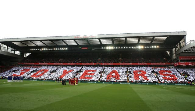 The Liverpool and Chelsea teams stand for a minute’s silence to commemorate the 30th anniversary of the Hillsborough disaster before the Premier League match at Anfield 