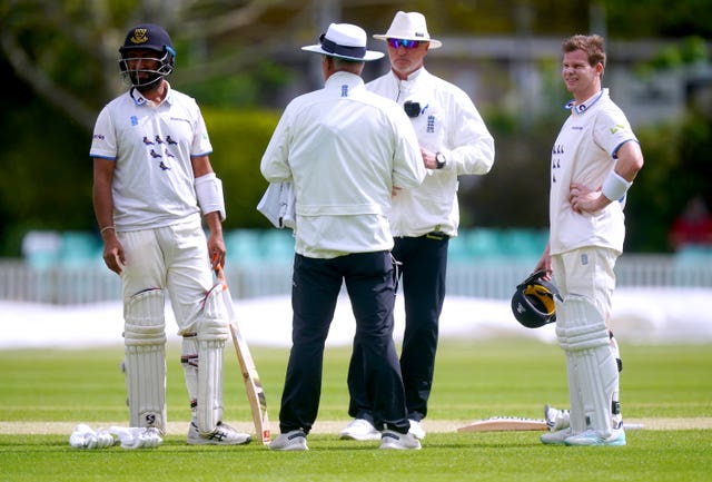 Smith and Pujara were both instructed to attach stem guards to their helmets (Mike Egerton/PA)