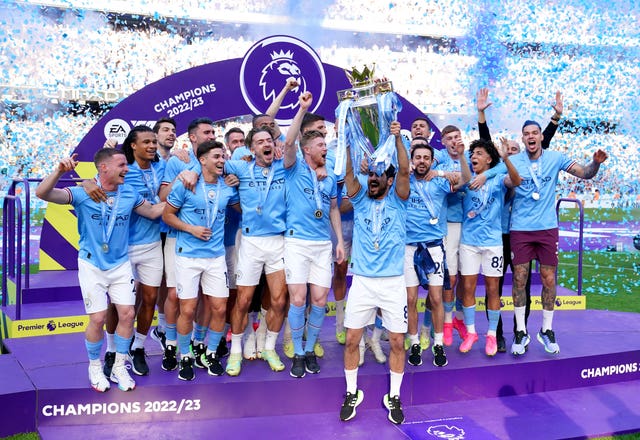Ilkay Gundogan lifts the Premier League trophy