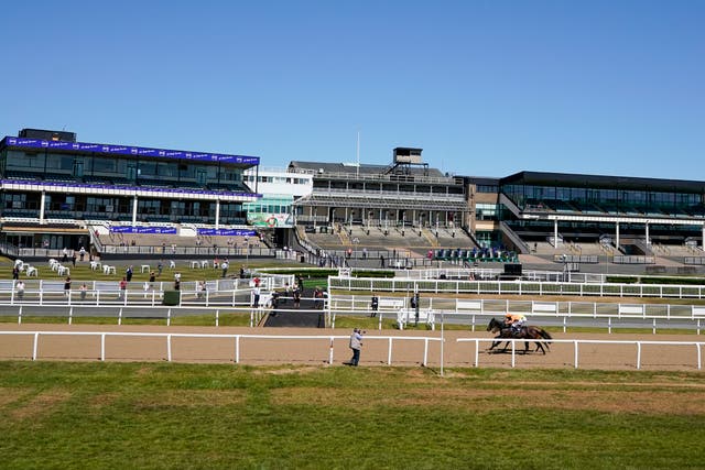 Zodiakos, orange, trained by Roger Fell and ridden by James Sullivan, wins the Betway Welcome Back British Racing Handicap at Newcastle