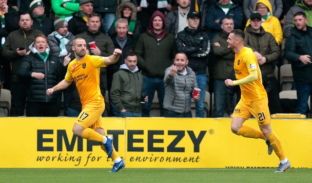 Livingston's Scott Robinson (left) celebrates scoring their first goal 