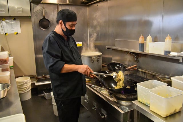 A chef prepared food for free lunch bags at Pho in Bristol