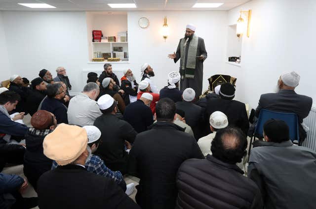 Iman Mufti Abdur Rahman Mangera speaks to members of the Muslim community in Stornoway on the Isle of Lewis as they attend the official opening of the first mosque in the Outer Hebrides (Andrew Milligan/PA)