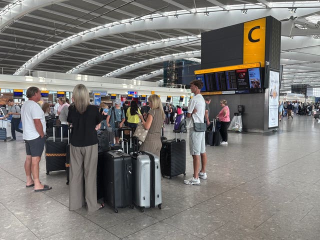 People queuing in airport terminal