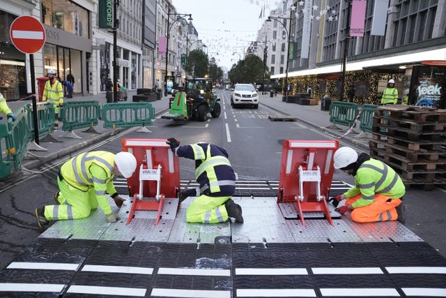 Final preparations are made on Oxford Street as pedestrianisation comes into force