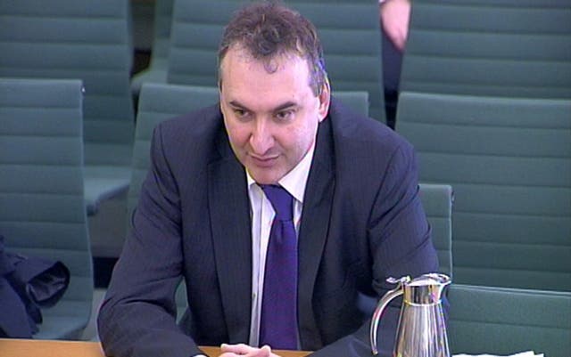 Sir Chris Wormald seated while giving evidence to a Commons committee
