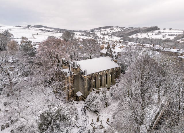 Snow surrounds All Saints Netherthong Church in Holmfirth, West Yorkshire