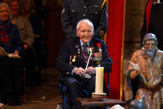 D-Day veteran Bernard Morgan holding a candle