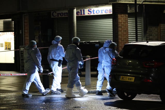 Forensic investigators at the scene in Woodman Parade, Newham