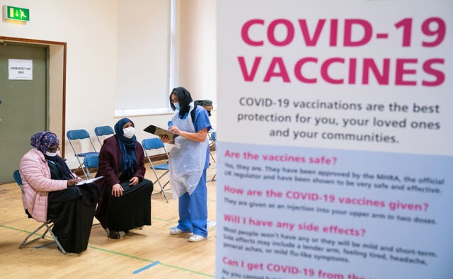 People attend a pop-up Covid-19 vaccination centre at the East London Mosque in Whitechapel 