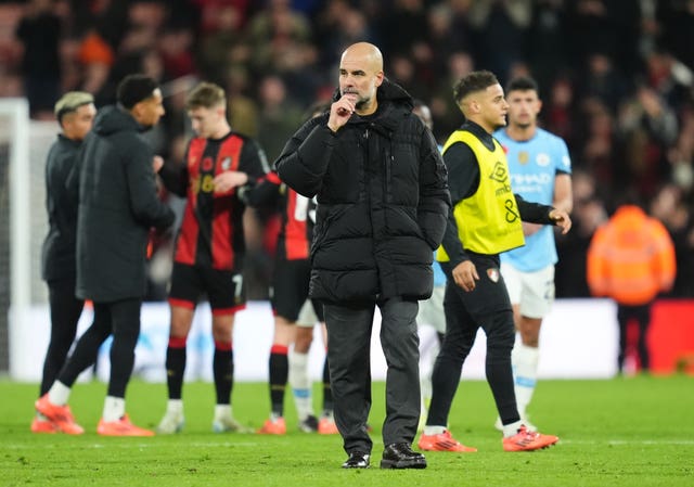 Manchester City manager Pep Guardiola on the pitch after the defeat 