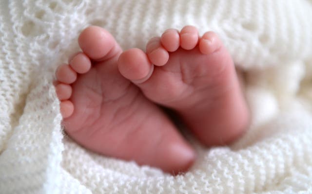 A baby's feet (Andrew Matthews/PA)